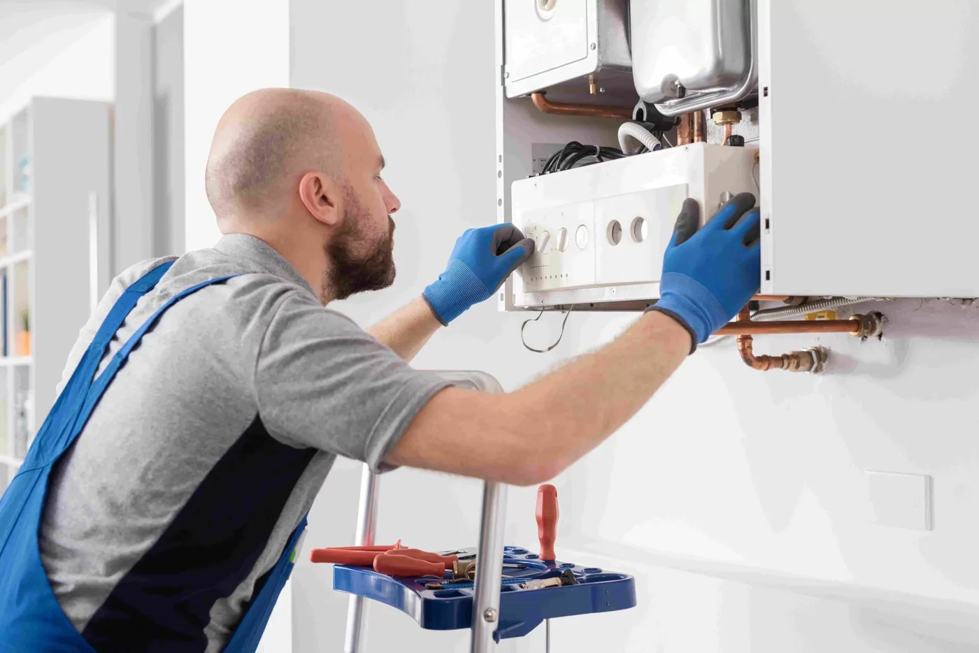 Technician servicing combi boiler in Vancouver